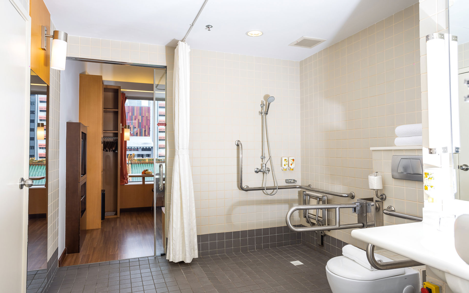 Designed for ease of use, our accessible-friendly bathroom provides safety and comfort with grab bars, emergency call buttons, and spacious entryways.