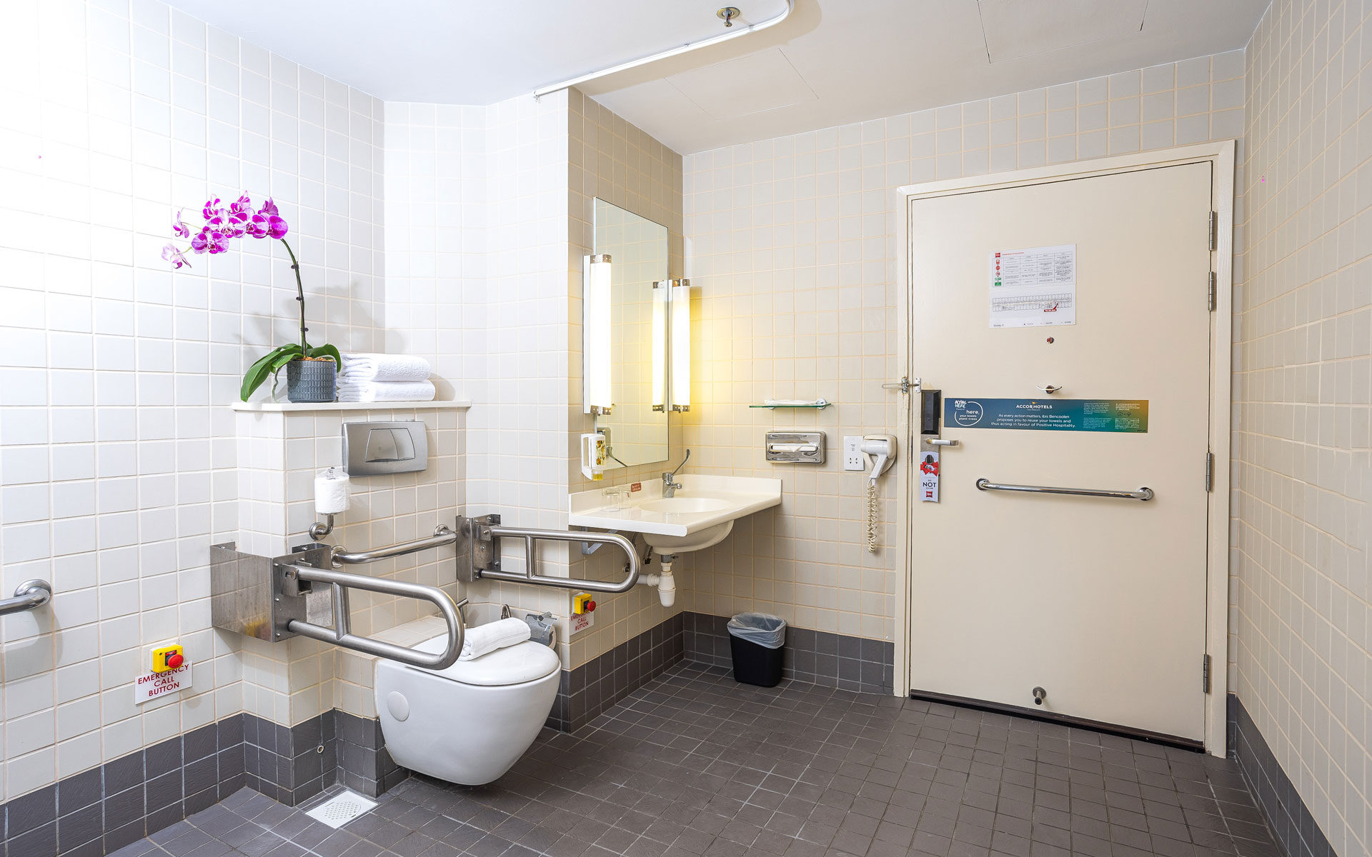 Accessible-friendly bathroom with grab bars and emergency call button at Ibis Singapore on Bencoolen.