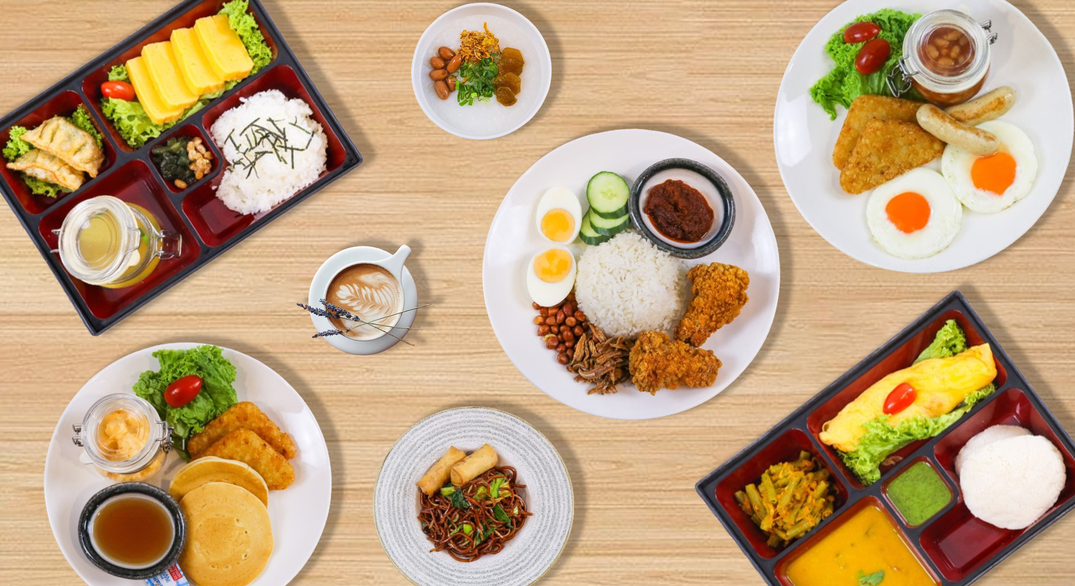 Plates of diverse breakfast dishes featuring both local and fusion cuisine, including nasi lemak, pancakes, eggs, and traditional side dishes, arranged on a table.