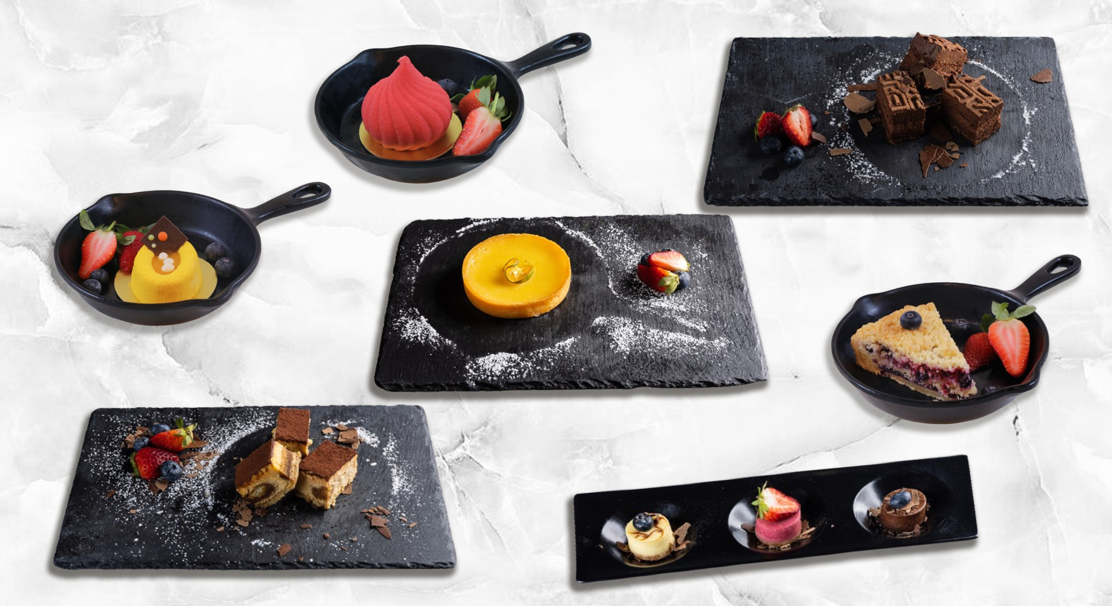 An assortment of gourmet desserts, including cakes, tarts, and other sweets, artfully presented on black plates and pans, garnished with fresh berries.