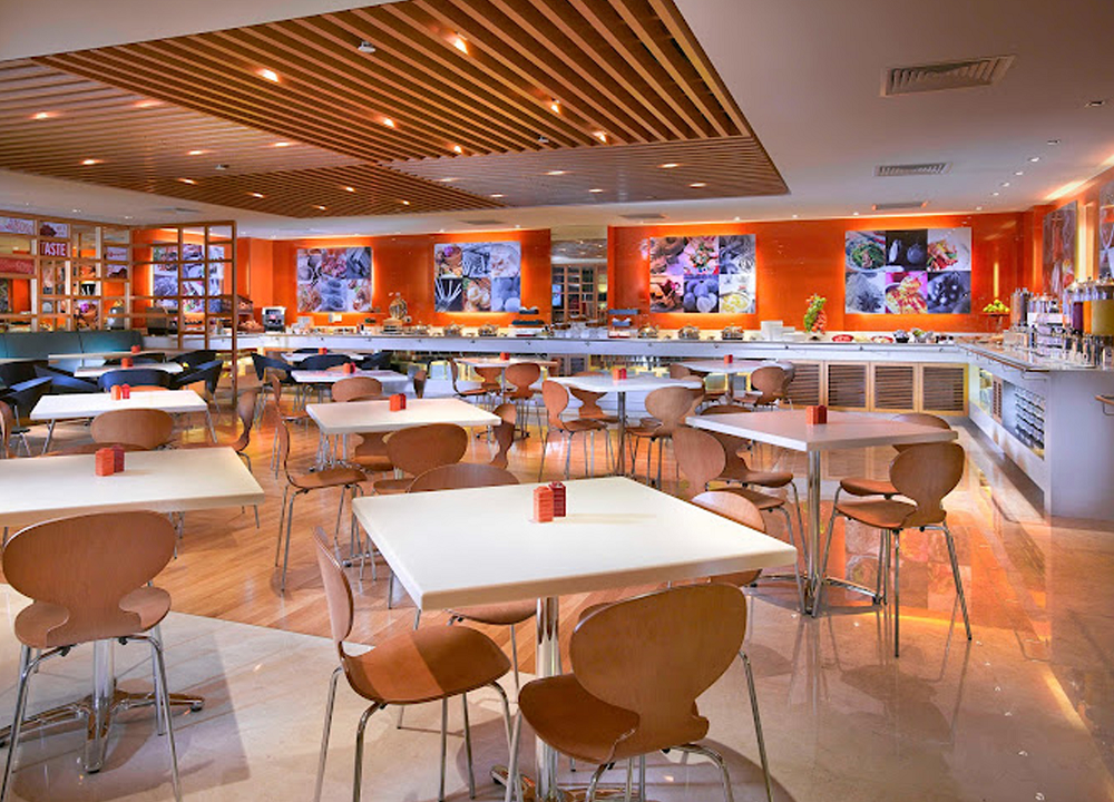 Bright and modern dining area at ibis hotel's restaurant.